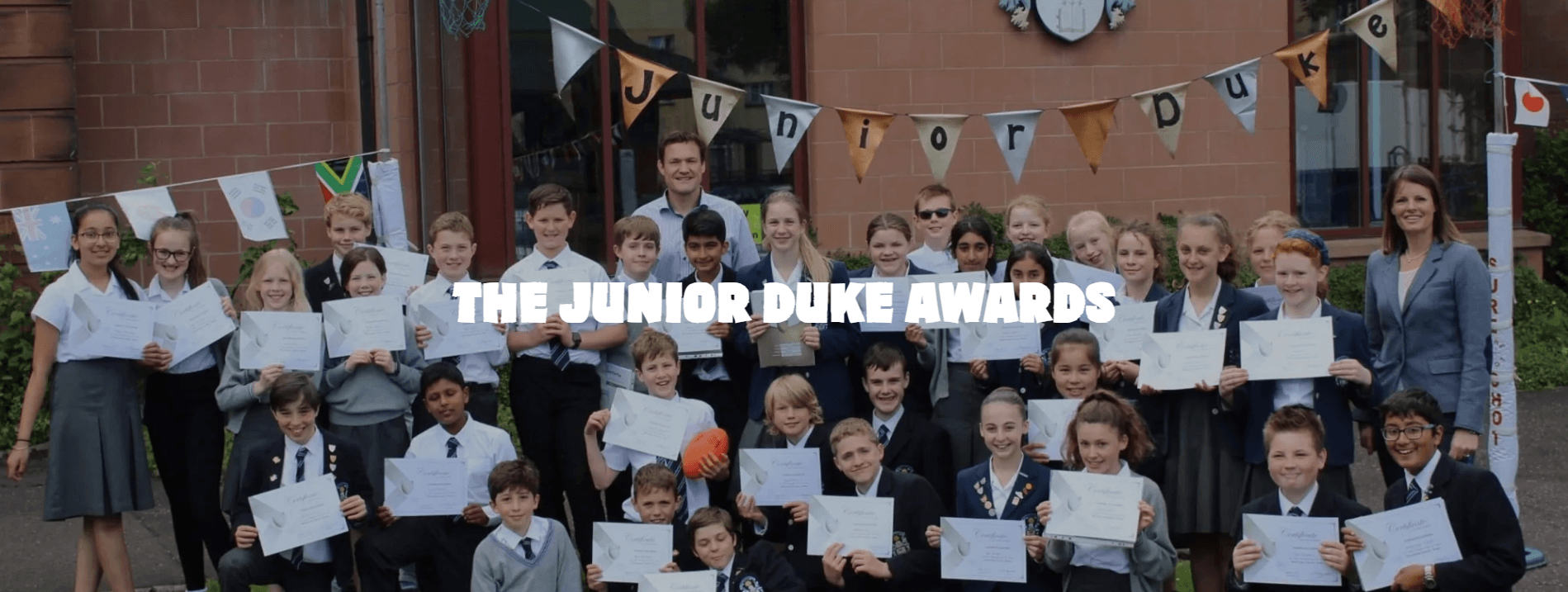 The Junior Duke Awards — a group of schoolchildren proudly holding their certificates